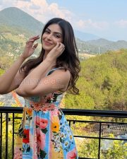 Radiant Actress Yesha Sagar in a Colorful Floral Print Square Neck Mini Dress Photos 03