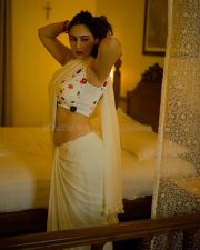 Sexy Megha Shukla in a White Saree and Printed Sleeveless Blouse Photos 02