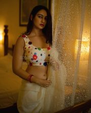 Sexy Megha Shukla in a White Saree and Printed Sleeveless Blouse Photos 04