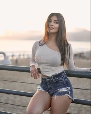 Sexy Yesha Sagar in a Ripped Denim Shorts Pictures 03
