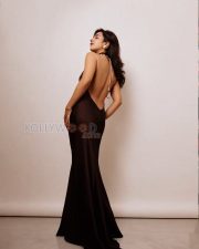 Stunning Actress Roshni Walia in a Black Backless Satin Halter Dress Photos 08