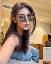 Stylish Actress Yesha Sagar in a Brown Sleeveless Top and Jeans Photos 01