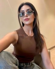 Stylish Actress Yesha Sagar in a Brown Sleeveless Top and Jeans Photos 03