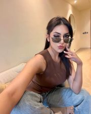 Stylish Actress Yesha Sagar in a Brown Sleeveless Top and Jeans Photos 04