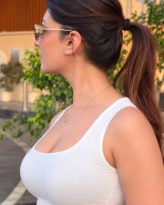 Stylish Cleavage Yesha Sagar in a White Ribbed Scoop Neck Tank Top Photos 02