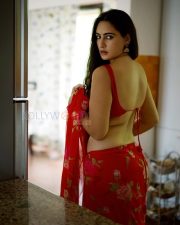 Sultry Actress Megha Shukla in a Red Floral Saree With Red Blouse Photos 04