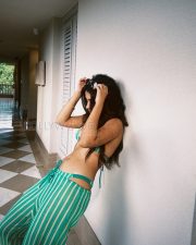 Sunkissed Roshni Walia Cleavage in a Teal Striped Crochet Bikini Top with Gold Sun Earrings Photos 04