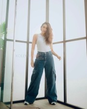Actress Karisma Kapoor in a Classic Jeans and White Top Photos 02