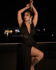 Desirable Ankita Dave in a Black Deep V Neck Dress with High Thigh Slit Photos 06