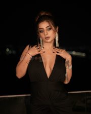 Desirable Ankita Dave in a Black Deep V Neck Dress with High Thigh Slit Photos 10