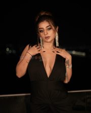 Desirable Ankita Dave in a Black Deep V Neck Dress with High Thigh Slit Photos 10