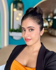 Sexy Shobhita Rana in an Orange Crop Top Black Jacket and Beige Pant Pictures 01