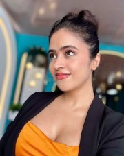 Sexy Shobhita Rana in an Orange Crop Top Black Jacket and Beige Pant Pictures 04