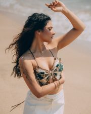 Winsome Actress Prisha Singh in a Embroidered Butterfly Crop Top And White Mini Skirt Photos 09