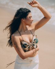 Winsome Actress Prisha Singh in a Embroidered Butterfly Crop Top And White Mini Skirt Photos 09