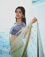 Elegant Actress Bhagyashri Borse in a Purple Embroidered Lehenga Photos 02