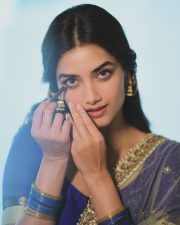 Elegant Actress Bhagyashri Borse in a Purple Embroidered Lehenga Photos 03