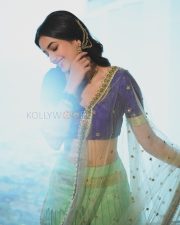 Elegant Actress Bhagyashri Borse in a Purple Embroidered Lehenga Photos 06