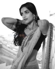Elegant Actress Bhagyashri Borse in a Purple Embroidered Lehenga Photos 09