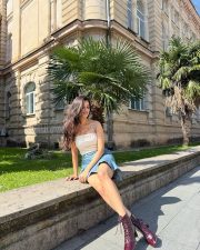 Stylish Bhagyashri Borse Legs in a white tube crop top denim mini skirt Photos 02 Stylish Bhagyashri Borse Legs in a white tube crop top denim mini skirt Photos 02
