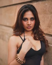 Alluring Srushti Bannatti in a Black Halter Style Crop Top with a Matching Black High Waisted Maxi Skirt Photos 02
