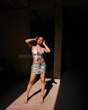 Captivating Actress Srushti Bannatti in a white lace up crop top with satin mini skirt photos 06
