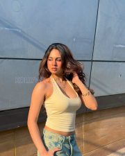 Confident Actress Srushti Bannatti in a Cream Halter Tank Top And Blue Denim Shorts Photos 02