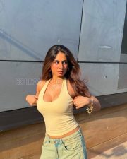 Confident Actress Srushti Bannatti in a Cream Halter Tank Top And Blue Denim Shorts Photos 04