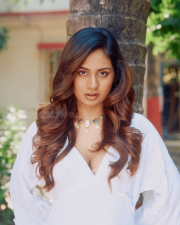 Enchanting Actress Srushti Bannatti in a White Ruffled Deep V Dress Photos 03
