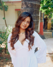 Enchanting Actress Srushti Bannatti in a White Ruffled Deep V Dress Photos 04