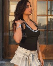 Eye catching Actress Srushti Bannatti in a Black Studded Halter Top And Mini Skirt Photos 03