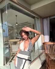 Sexy Jiya Shankar in a Black and White Monochrome Gown with a Cleavage Neckline Vacation Photos 03
