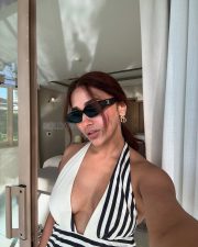 Sexy Jiya Shankar in a Black and White Monochrome Gown with a Cleavage Neckline Vacation Photos 04