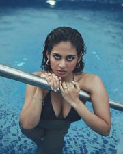 Sultry Srushti Bannatti Cleavage in a Black Swimsuit Photos 01