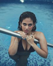 Sultry Srushti Bannatti Cleavage in a Black Swimsuit Photos 01