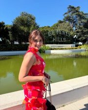 Vibrant Beauty Jiya Shankar in a Red Floral Printed Maxi Dress Photos 04