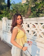 Winsome Actress Srushti Bannatti in a Yellow Sheer Tie Front Crop Top and Denim Jeans Photos 02