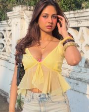 Winsome Actress Srushti Bannatti in a Yellow Sheer Tie Front Crop Top and Denim Jeans Photos 03