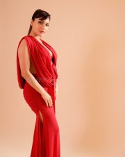 Wild Wild Punjab Actress Ishita Raj in a Red Draped Maxi Gown with a Deep Cleavage Neckline Pictures 01