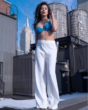 Actress Niharica Raizada in a White Track Pants and Blue Bra Photos 01