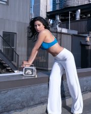 Actress Niharica Raizada in a White Track Pants and Blue Bra Photos 02