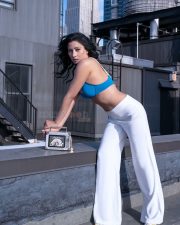 Actress Niharica Raizada in a White Track Pants and Blue Bra Photos 02