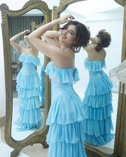 Actress Rasha Thadani in a Blue off Shoulder Corset Style Ruffle Gown Photos 03