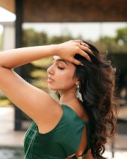 Captivating Actress Akshatha Das in a Emerald Green Beaded Crop Top and Draped Slit Skirt Photos 06