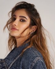 Cute and Chic Rasha Thadani in a White Crop Top with Denim Jacket and Jeans Pictures 01