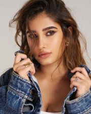 Cute and Chic Rasha Thadani in a White Crop Top with Denim Jacket and Jeans Pictures 06