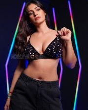 Daring Shivangi Verma Cleavage in a Black Sequin Deep V Triangle Halter Bra Top Black Baggy Cargo Pants Photos 08