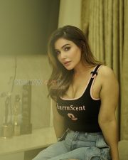 Fierce Shivangi Verma Cleavage in a Black Logo Crop Top and Ripped Denim Jeans Photos 07