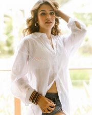 Photogenic Actress Vidhi Yadav in a White Sheer Shirt and Denim Shorts Photos 01