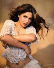 Bai Ga Actress Neha Khan in a Cream Open Knit Cardigan with a Black Polka Dot Bralette and High Waisted Trousers Photos 02